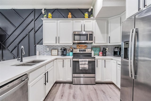 3210 W Horatio St Unit 9, Tampa, FL 33609 - kitchen with stainless steel appliances, light countertops, and backsplash