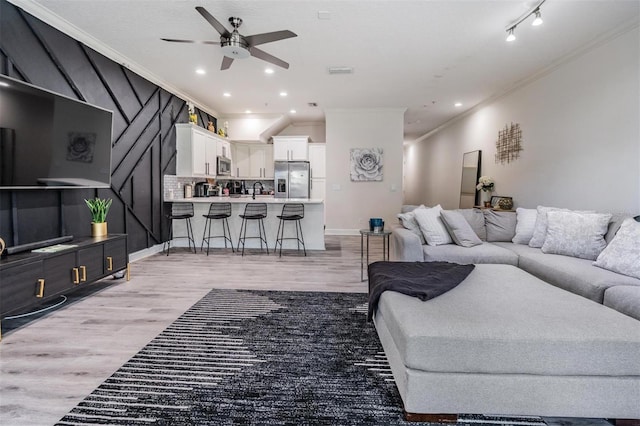 3210 W Horatio St Unit 9, Tampa, FL 33609 - living area with crown molding, a ceiling fan, light wood finished floors, and recessed lighting