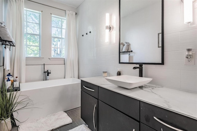 3210 W Horatio St Unit 9, Tampa, FL 33609 - full bath featuring vanity and decorative backsplash