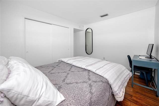 4050 4th St N Unit 116, Saint Petersburg, FL 33703 - bedroom featuring a closet and dark wood finished floors