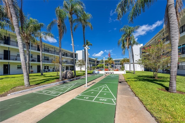 4050 4th St N Unit 116, Saint Petersburg, FL 33703 - surrounding community featuring a yard and shuffleboard