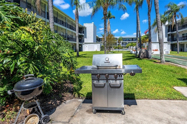 4050 4th St N Unit 116, Saint Petersburg, FL 33703 - view of patio / terrace with a grill and shuffleboard
