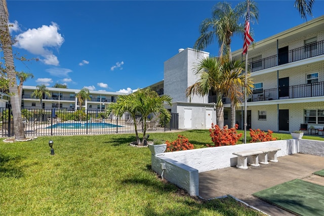 4050 4th St N Unit 116, Saint Petersburg, FL 33703 - view of community with a pool and a patio