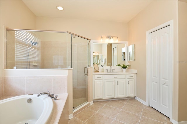 15412 Carrillon Estates Blvd, Tampa, FL 33625 - bathroom featuring vanity, a bath, a shower stall, tile patterned floors, and a closet