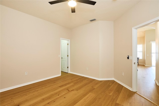 15412 Carrillon Estates Blvd, Tampa, FL 33625 - spare room featuring ceiling fan, light wood-style floors, and arched walkways