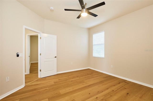 15412 Carrillon Estates Blvd, Tampa, FL 33625 - spare room with light wood-type flooring, a ceiling fan, and a smoke detector