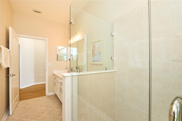 15412 Carrillon Estates Blvd, Tampa, FL 33625 - bathroom with vanity, a tile shower, and tile patterned floors