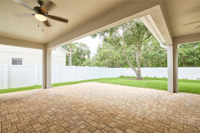15412 Carrillon Estates Blvd, Tampa, FL 33625 - fenced backyard with ceiling fan and a patio