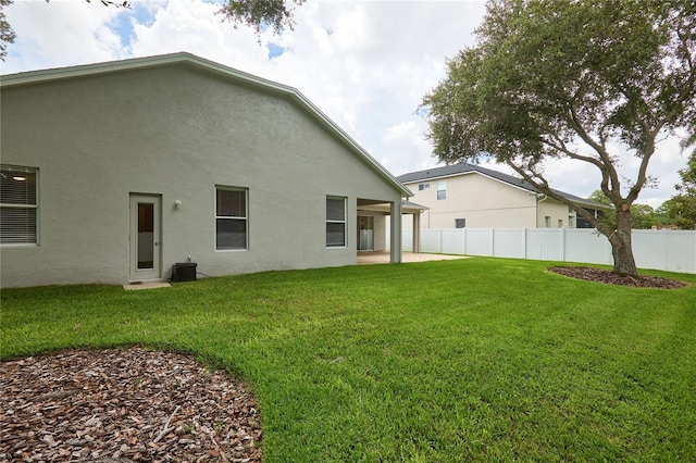 15412 Carrillon Estates Blvd, Tampa, FL 33625 - rear view of property with stucco siding and a patio