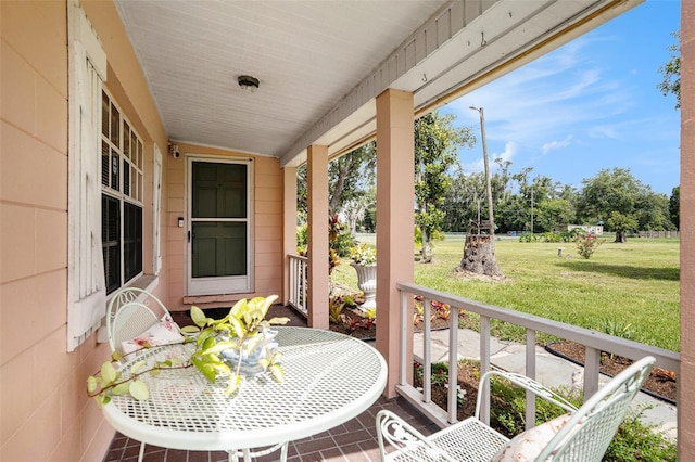 235 Old Welcome Rd, Lithia, FL 33547 - covered porch featuring outdoor dining space