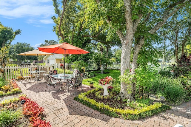 235 Old Welcome Rd, Lithia, FL 33547 - fenced backyard featuring a patio area and outdoor dining space