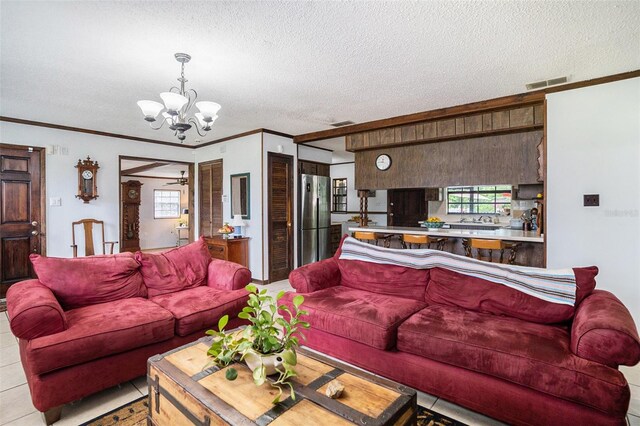 235 Old Welcome Rd, Lithia, FL 33547 - living area with a textured ceiling, crown molding, a chandelier, plenty of natural light, and ceiling fan