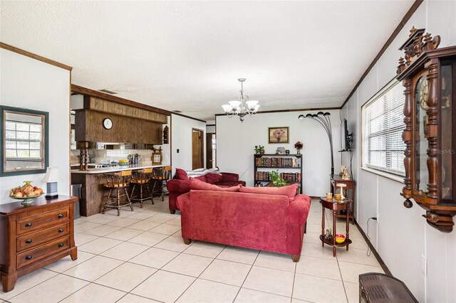 235 Old Welcome Rd, Lithia, FL 33547 - living room featuring a chandelier, crown molding, and light tile patterned floors
