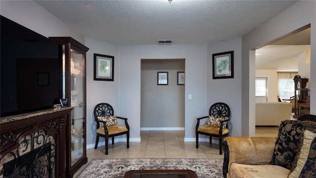 270 Planter Rd, Spring Hill, FL 34606 - living room with light tile patterned floors and a textured ceiling