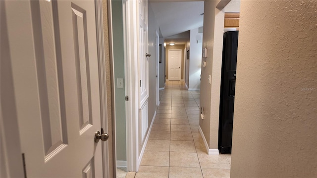 270 Planter Rd, Spring Hill, FL 34606 - hallway featuring light tile patterned flooring, a textured wall, and lofted ceiling