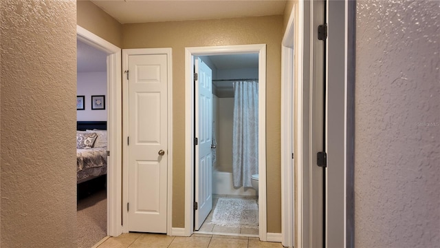 270 Planter Rd, Spring Hill, FL 34606 - hallway featuring a textured wall and light tile patterned flooring