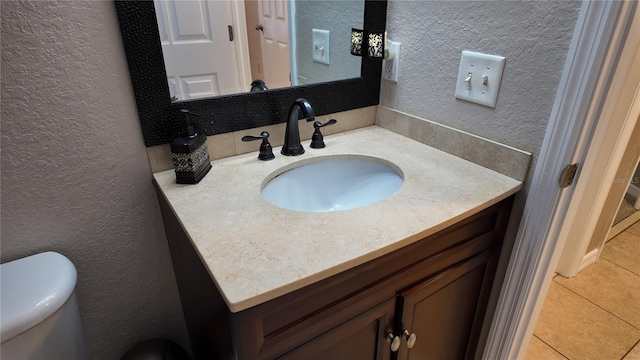 270 Planter Rd, Spring Hill, FL 34606 - bathroom featuring a textured wall, vanity, and tile patterned floors