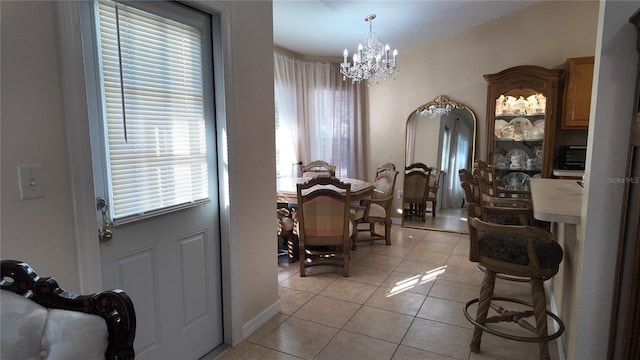 270 Planter Rd, Spring Hill, FL 34606 - dining room featuring a chandelier and light tile patterned floors