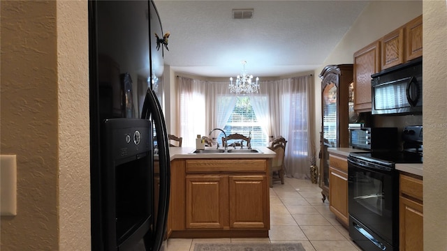 270 Planter Rd, Spring Hill, FL 34606 - kitchen with black appliances, a textured wall, a chandelier, light tile patterned floors, and brown cabinets