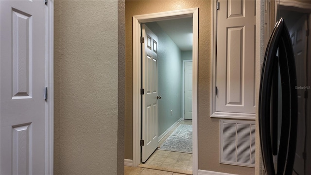 270 Planter Rd, Spring Hill, FL 34606 - corridor featuring a textured wall and light tile patterned floors