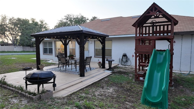 270 Planter Rd, Spring Hill, FL 34606 - wooden terrace with a playground, a gazebo, and a grill