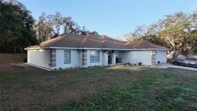 270 Planter Rd, Spring Hill, FL 34606 - ranch-style home with an attached garage, a front yard, stucco siding, and driveway