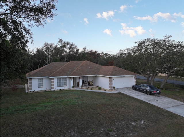 270 Planter Rd, Spring Hill, FL 34606 - ranch-style house featuring concrete driveway, a front lawn, a garage, and covered porch