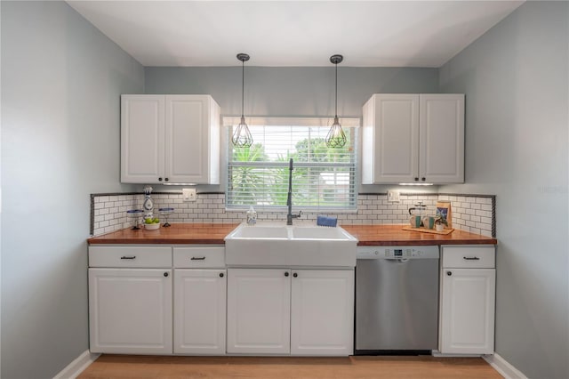 811 W Peninsular St, Tampa, FL 33603 - kitchen featuring stainless steel dishwasher, butcher block countertops, and decorative backsplash
