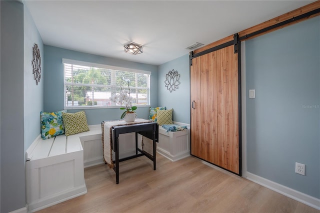 811 W Peninsular St, Tampa, FL 33603 - office area featuring light wood-style floors and a barn door