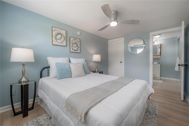 811 W Peninsular St, Tampa, FL 33603 - bedroom featuring wood finished floors, ensuite bath, and ceiling fan