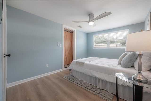 811 W Peninsular St, Tampa, FL 33603 - bedroom with wood finished floors, a ceiling fan, and a closet