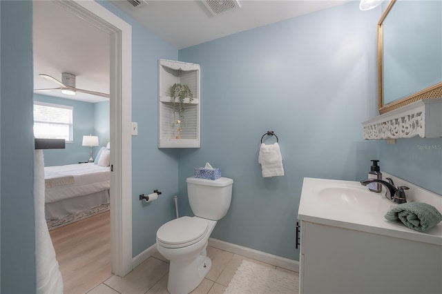 811 W Peninsular St, Tampa, FL 33603 - bathroom featuring vanity, ceiling fan, ensuite bathroom, and tile patterned flooring