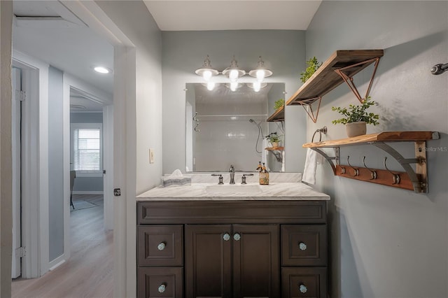 811 W Peninsular St, Tampa, FL 33603 - full bathroom featuring vanity, wood finished floors, a shower, and a chandelier
