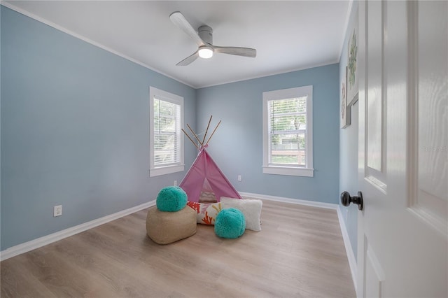 811 W Peninsular St, Tampa, FL 33603 - unfurnished room featuring healthy amount of natural light, wood finished floors, crown molding, and ceiling fan