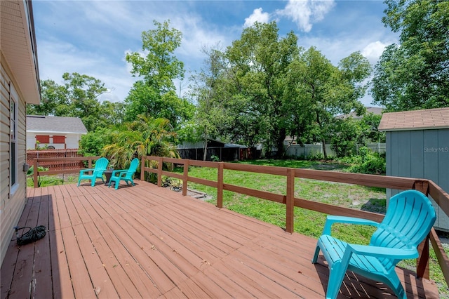 811 W Peninsular St, Tampa, FL 33603 - wooden terrace with a fenced backyard and a storage shed