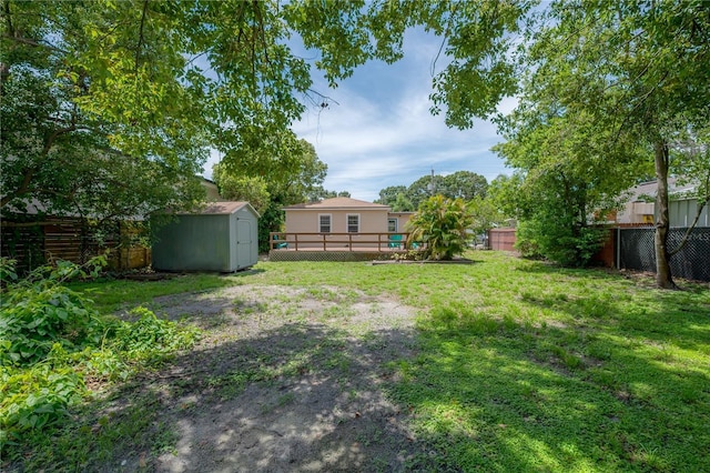 811 W Peninsular St, Tampa, FL 33603 - fenced backyard featuring a storage unit and a deck