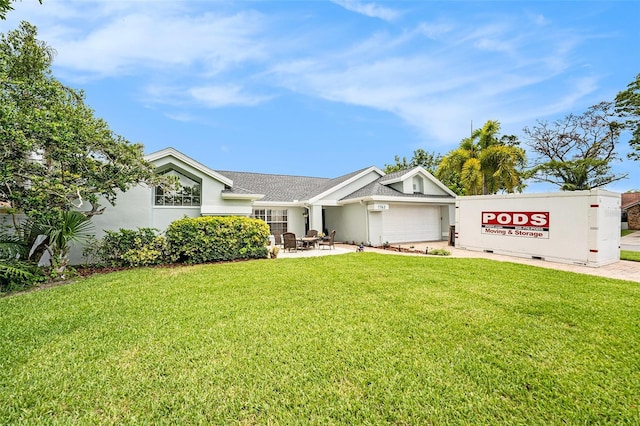 1763 Pebble Hill Ct, Palm Harbor, FL 34683 - view of front facade featuring a garage, a front lawn, stucco siding, and roof with shingles