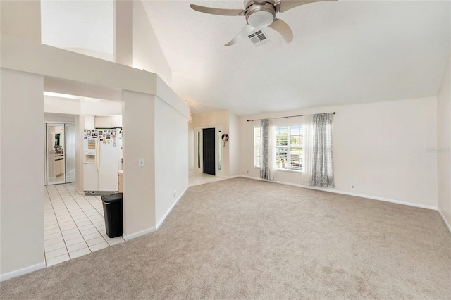 1763 Pebble Hill Ct, Palm Harbor, FL 34683 - unfurnished living room featuring light colored carpet, ceiling fan, light tile patterned floors, and high vaulted ceiling