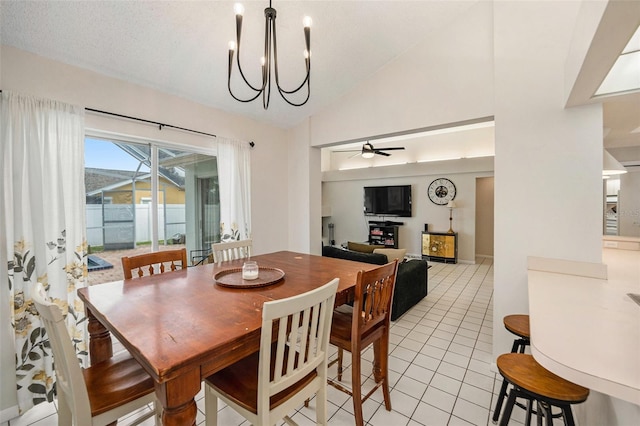 1763 Pebble Hill Ct, Palm Harbor, FL 34683 - dining space featuring light tile patterned flooring, a ceiling fan, a chandelier, and high vaulted ceiling