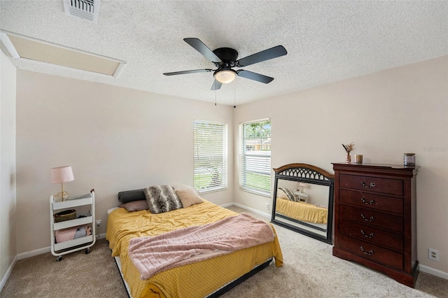1763 Pebble Hill Ct, Palm Harbor, FL 34683 - bedroom with light colored carpet, ceiling fan, and a textured ceiling