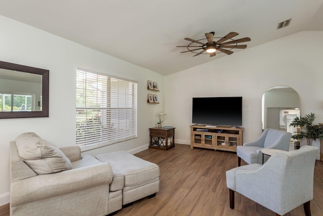2800 Resnik Cir W, Palm Harbor, FL 34683 - living room featuring lofted ceiling, ceiling fan, wood finished floors, and arched walkways