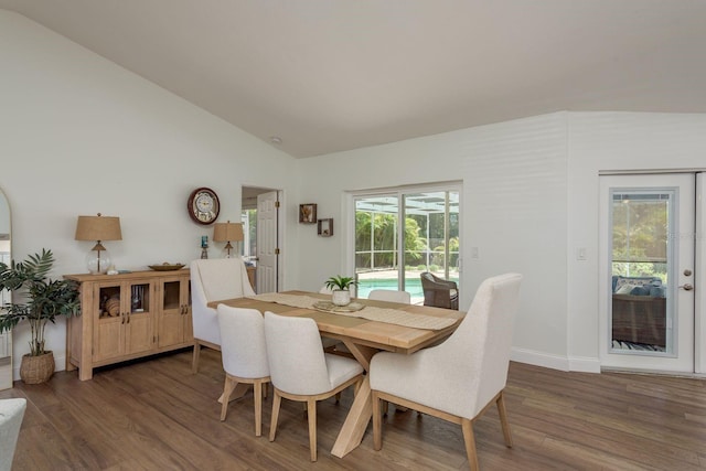 2800 Resnik Cir W, Palm Harbor, FL 34683 - dining space featuring wood finished floors and vaulted ceiling