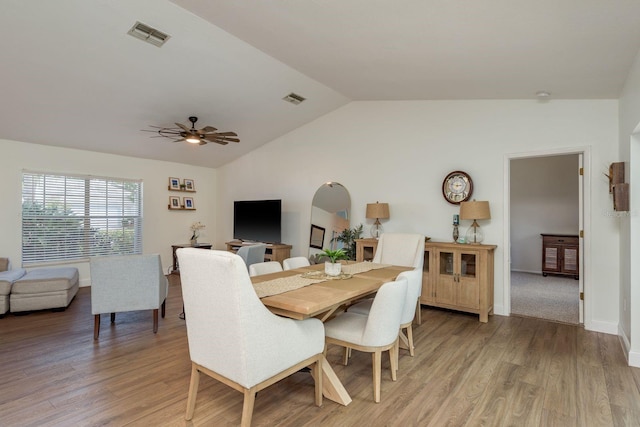 2800 Resnik Cir W, Palm Harbor, FL 34683 - dining room featuring lofted ceiling, ceiling fan, and light wood-style flooring