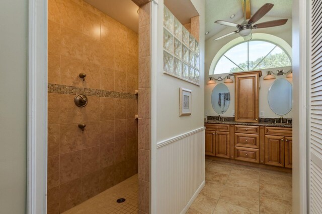 2800 Resnik Cir W, Palm Harbor, FL 34683 - full bathroom featuring a walk in shower, a ceiling fan, double vanity, lofted ceiling, and a wainscoted wall
