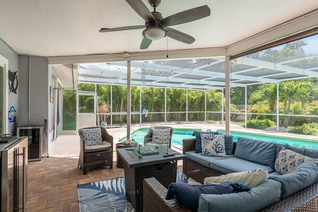 2800 Resnik Cir W, Palm Harbor, FL 34683 - sunroom with outdoor lounge area, a ceiling fan, beverage cooler, and plenty of natural light