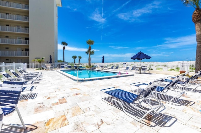 1150 Tarpon Center Dr Unit 1D, Venice, FL 34285 - community pool featuring a patio