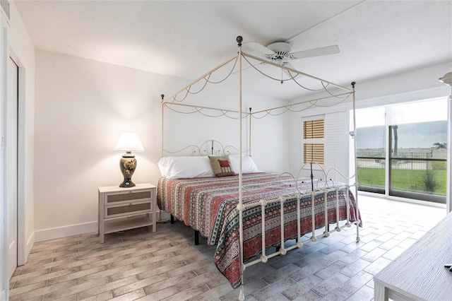 1150 Tarpon Center Dr Unit 1D, Venice, FL 34285 - bedroom featuring baseboards and ceiling fan