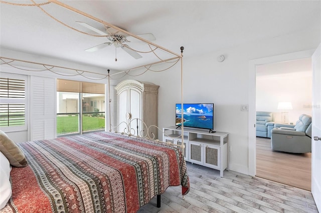 1150 Tarpon Center Dr Unit 1D, Venice, FL 34285 - bedroom featuring wood finished floors and ceiling fan
