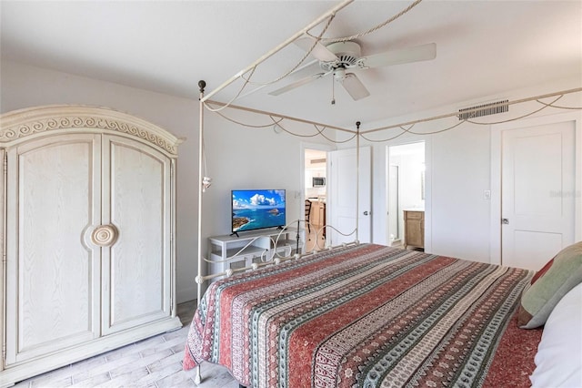 1150 Tarpon Center Dr Unit 1D, Venice, FL 34285 - bedroom with a ceiling fan and light wood-type flooring