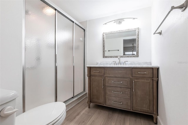 1150 Tarpon Center Dr Unit 1D, Venice, FL 34285 - full bath with wood finished floors, a shower stall, and vanity